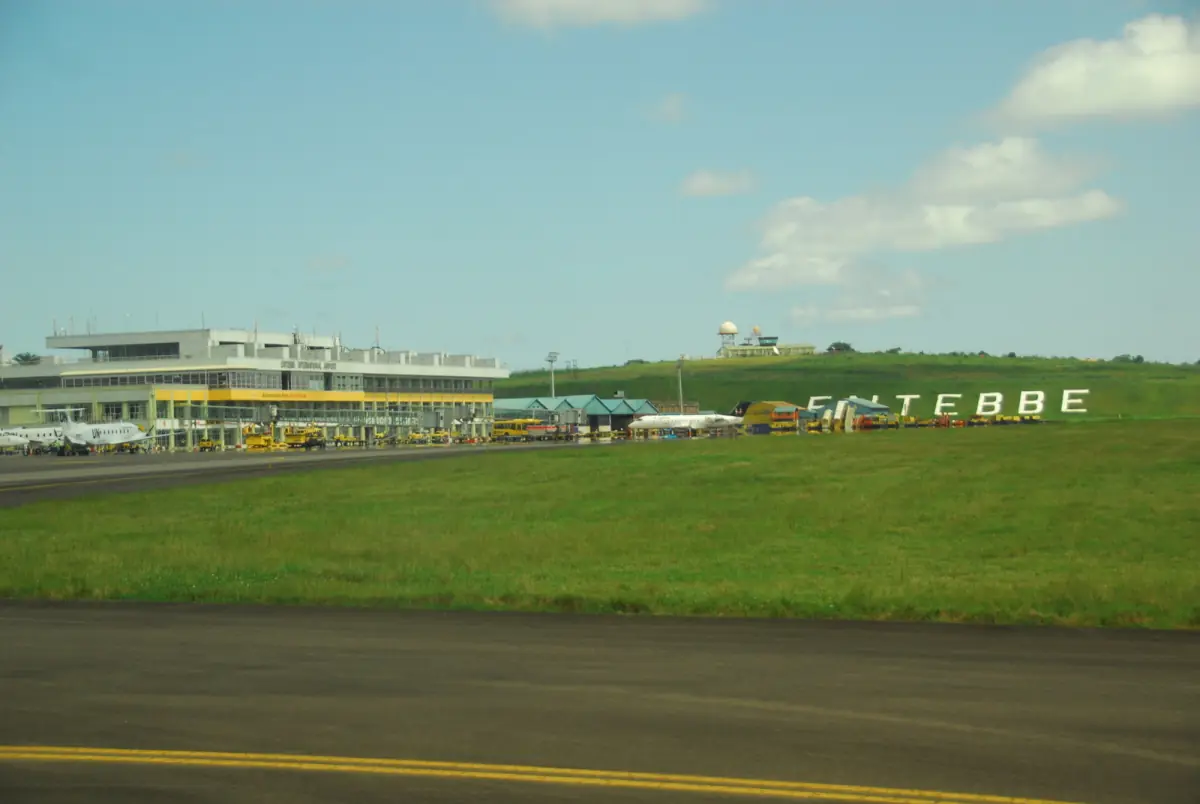 Entebbe airport terminal seen across the grassy airfield